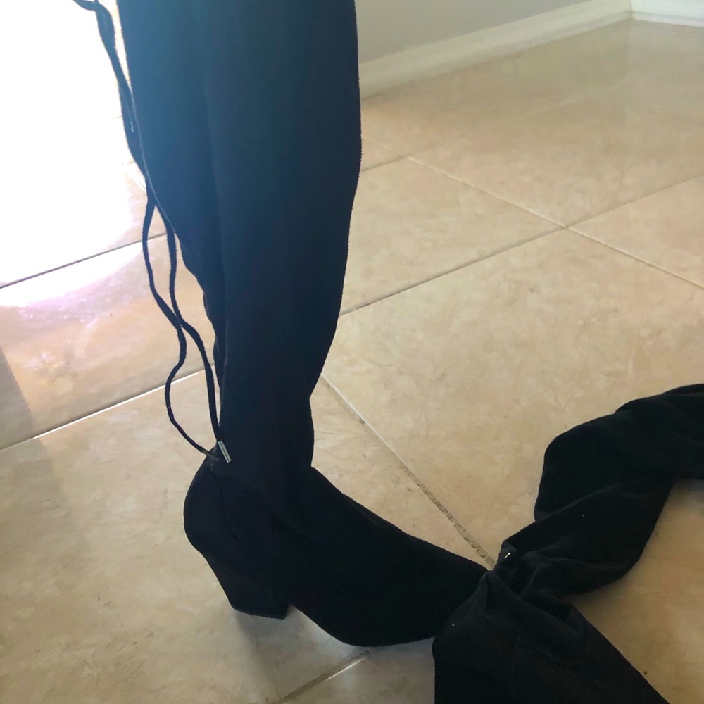 Black suede thigh high heeled boots
